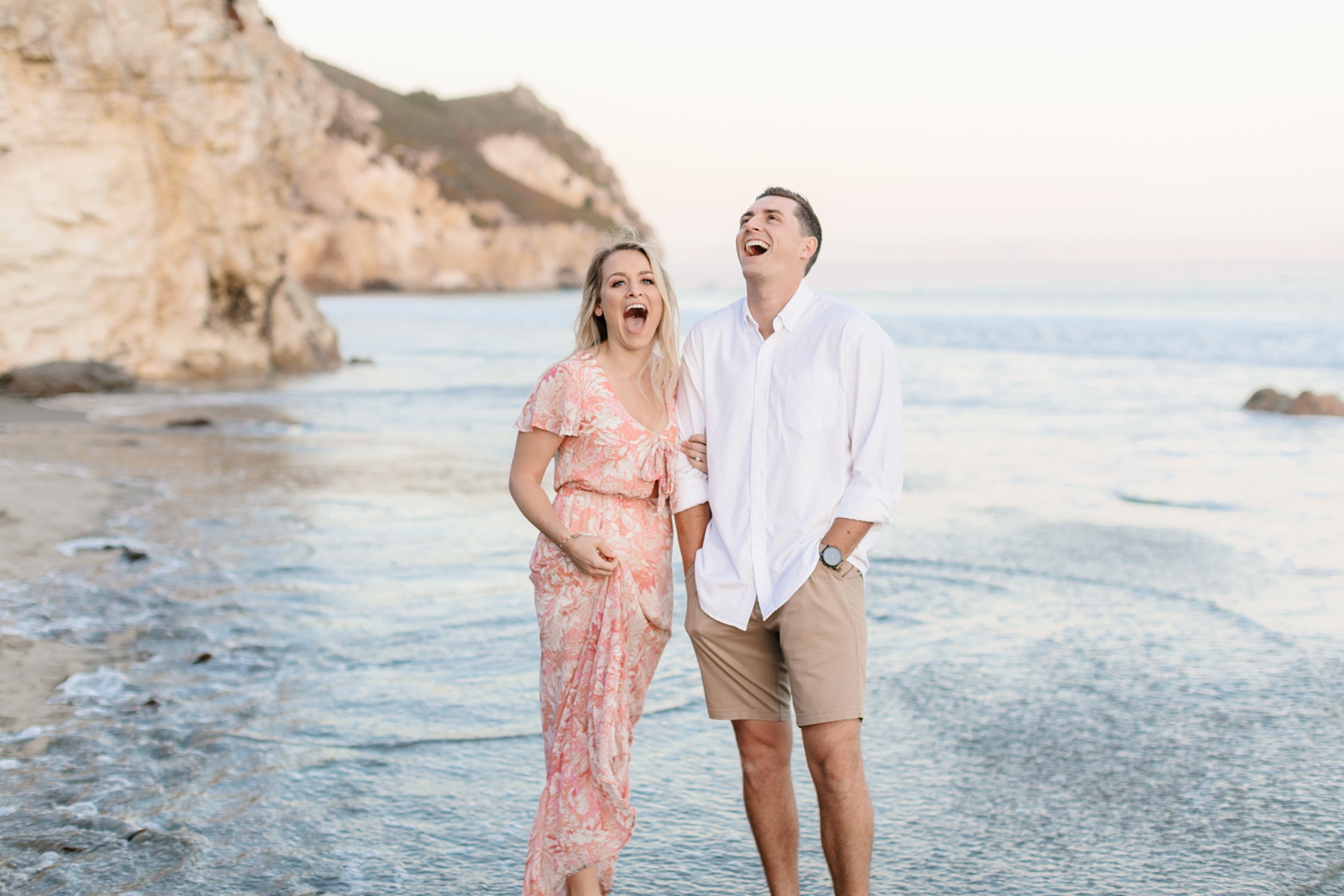 Couple laughing at Avila beach engagement session