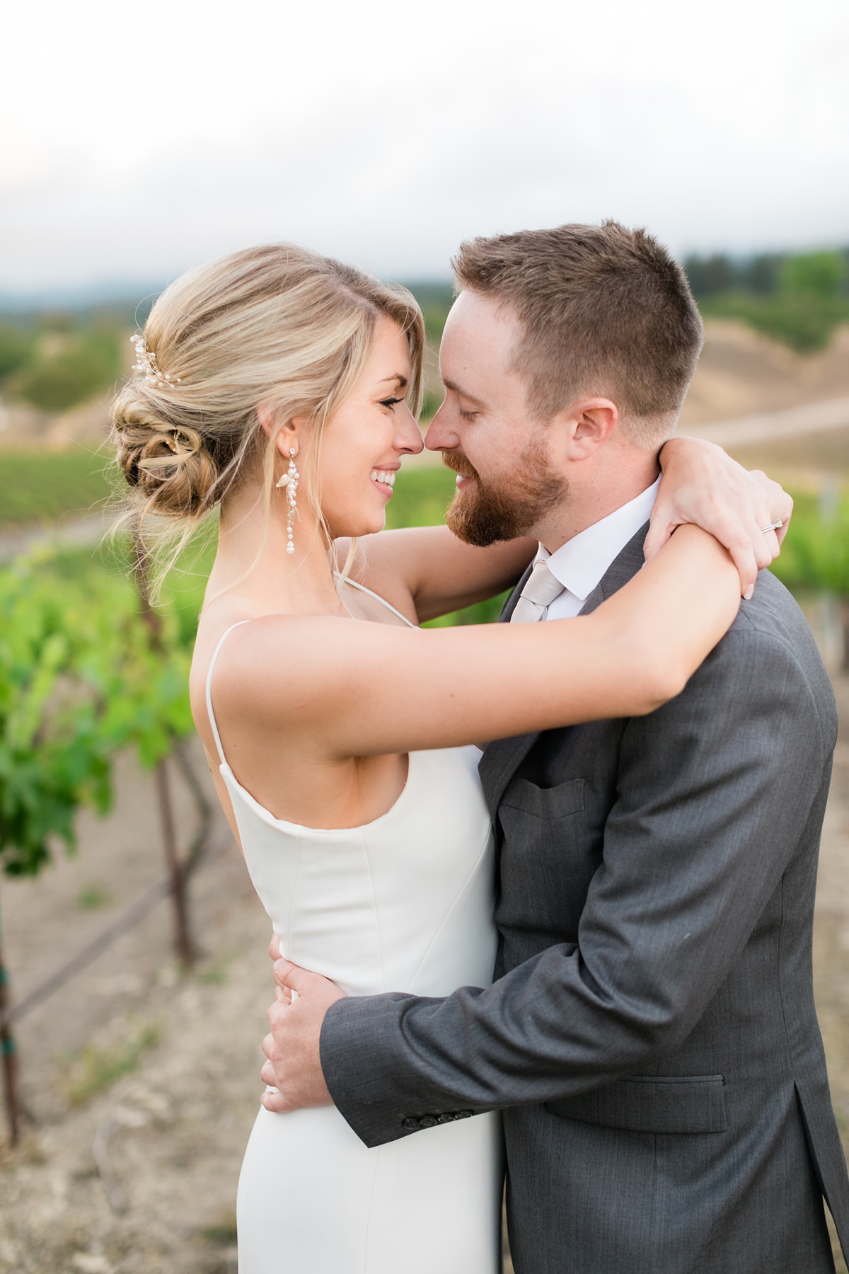 Opolo Winery wedding bride and groom embrace in vineyards