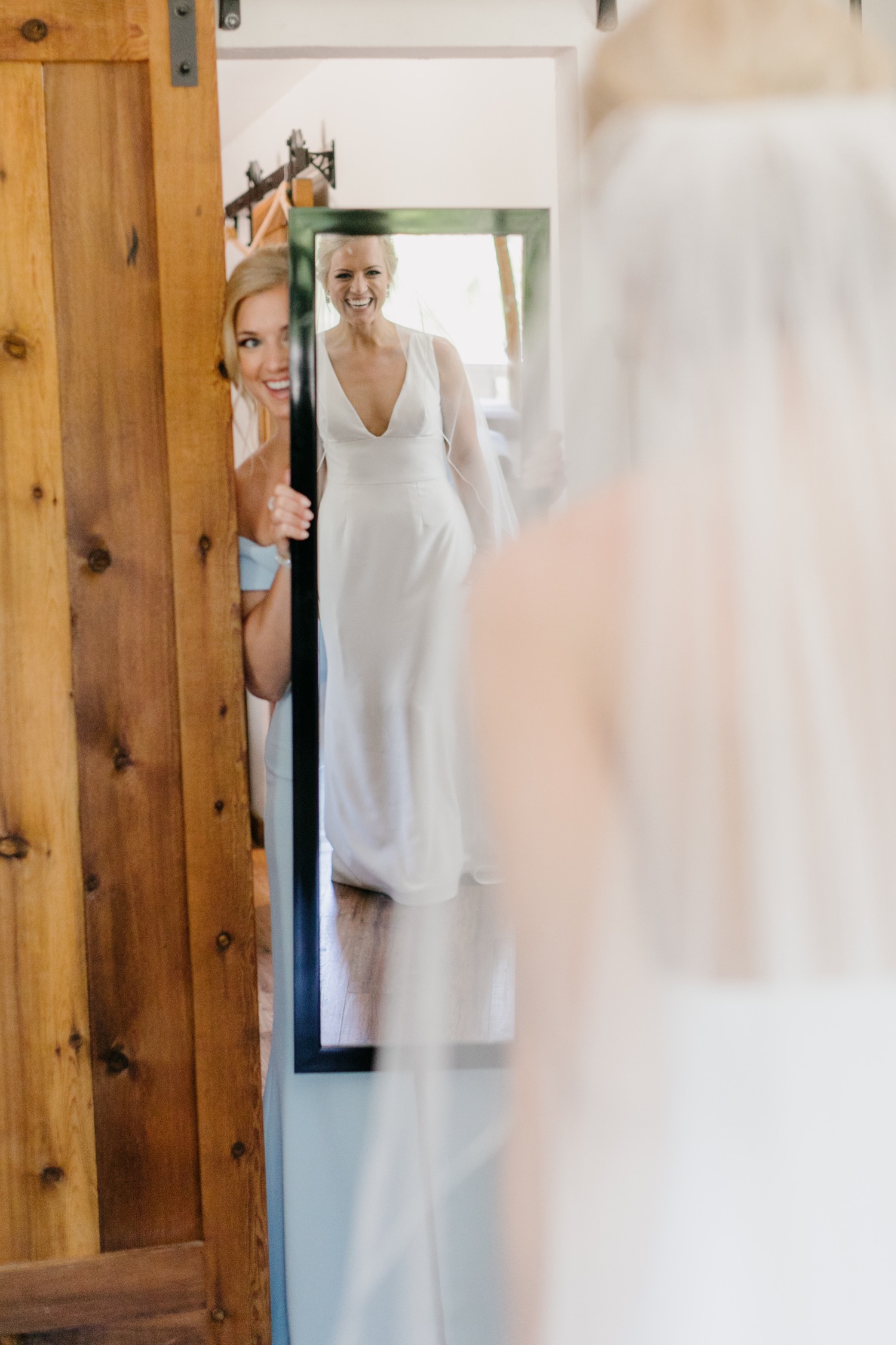 bride seeing herself in the mirror while getting ready at her terra mia wedding