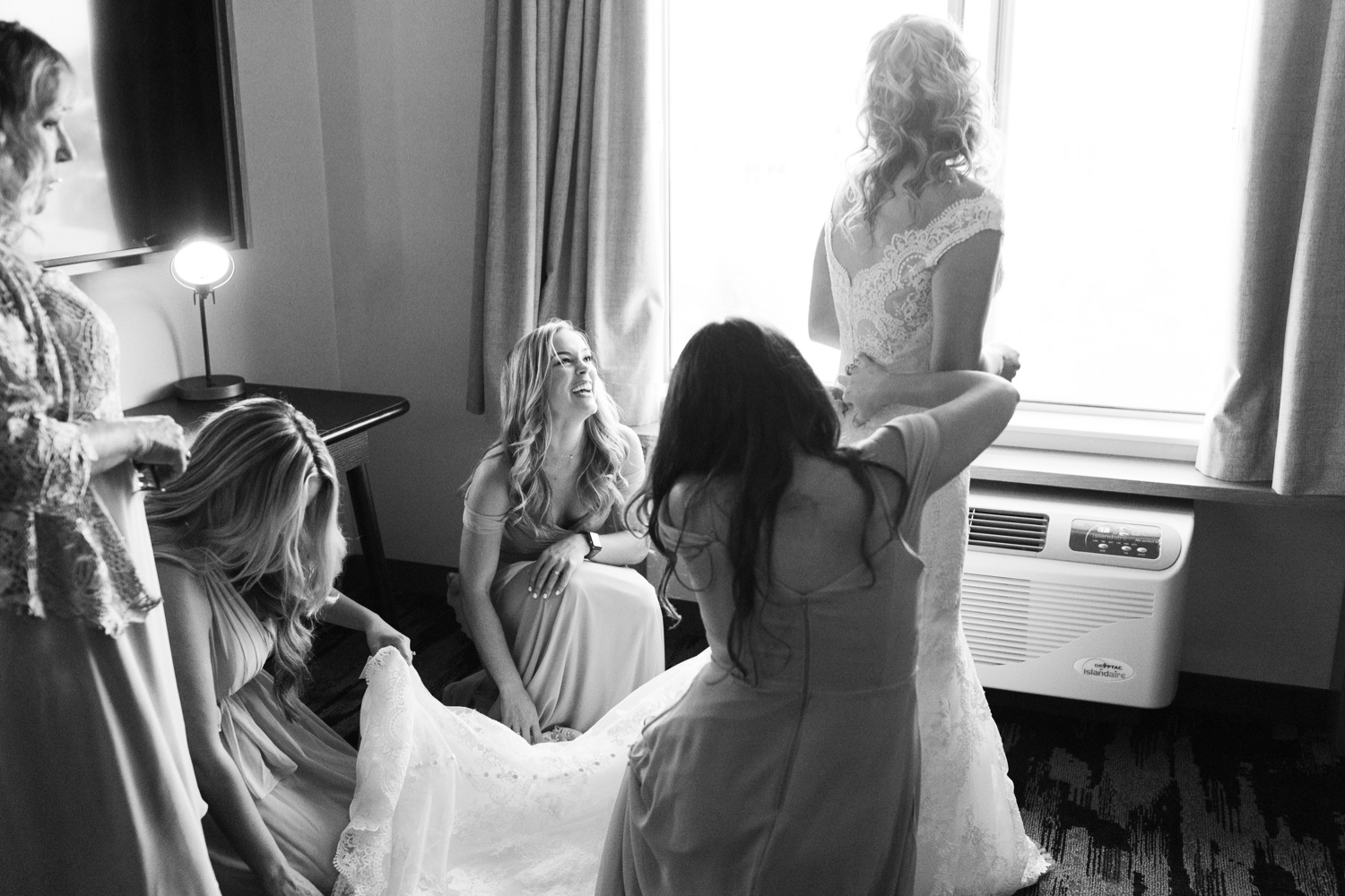 sisters getting ready before a wedding