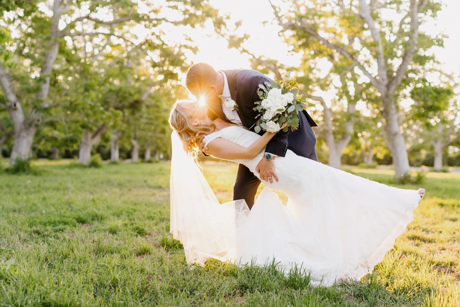 bride and groom dip kiss at sunset photos in Moorpark, california