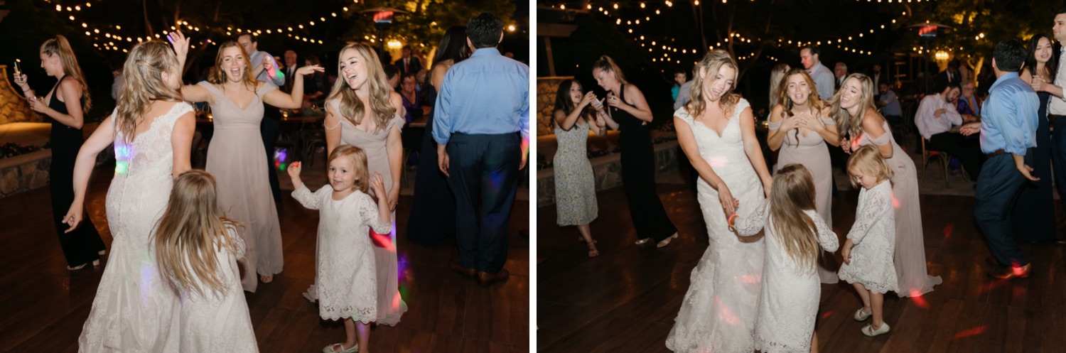 bride dancing with her sisters and nieces at her wedding reception