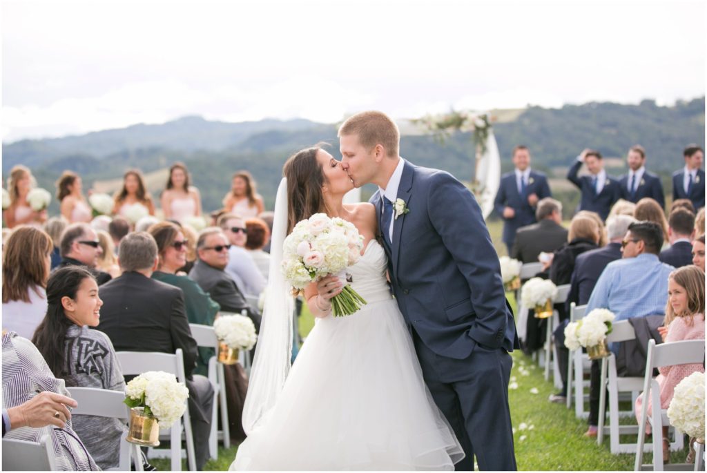 Hilltop ceremony wedding at Opolo vineyard winery first kiss