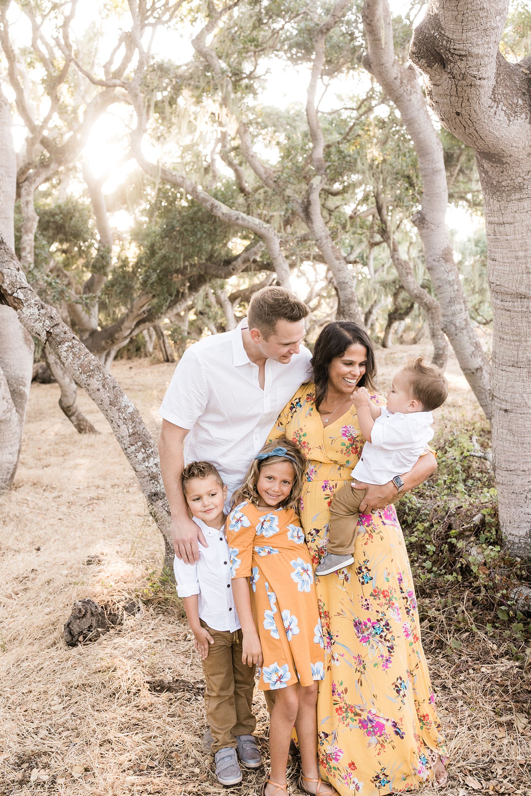 family posing together at the Los Osos Oaks Reserve photographed by Tayler Enerle