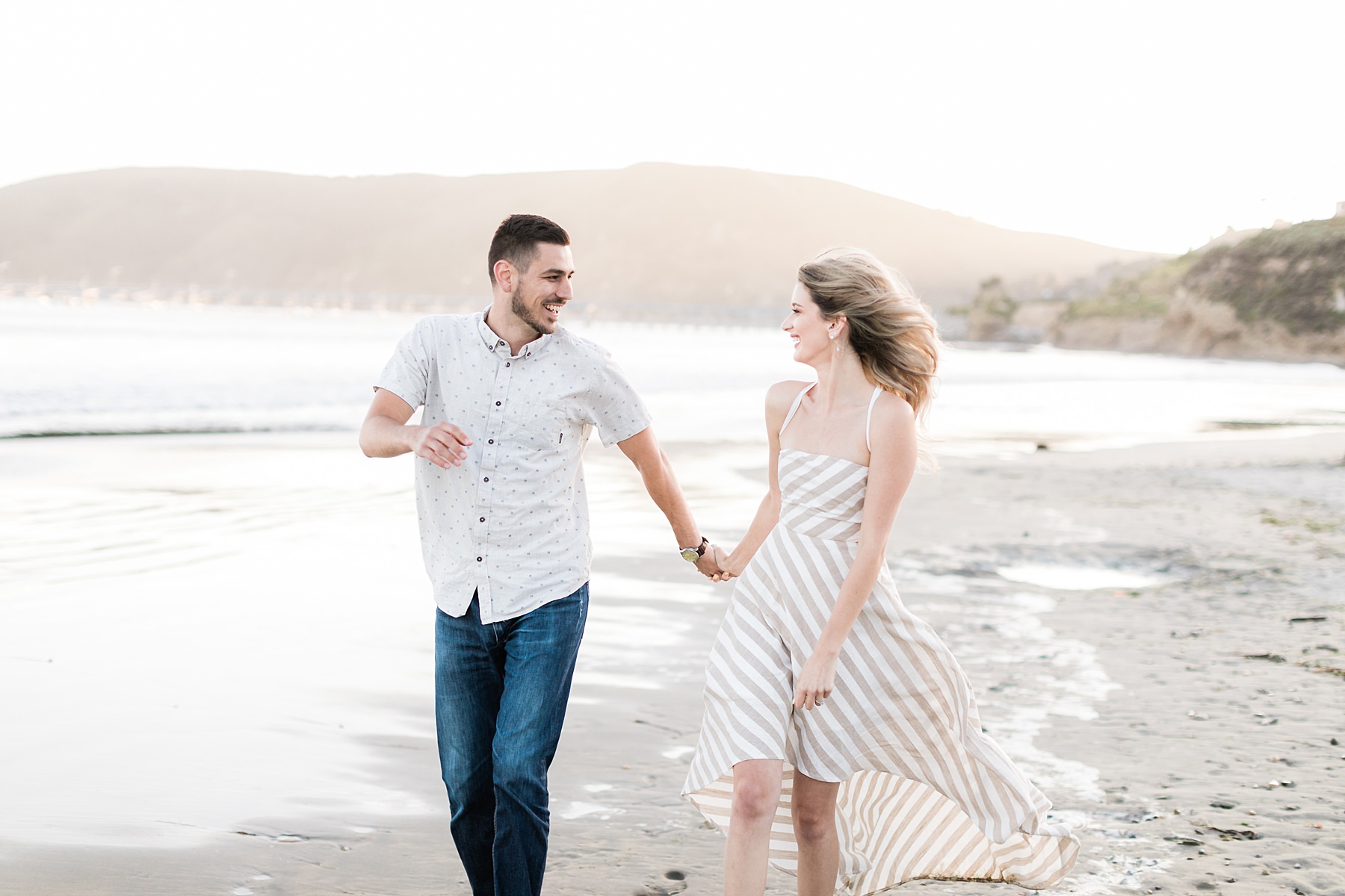 Couple laughing at Avila Beach engagement session