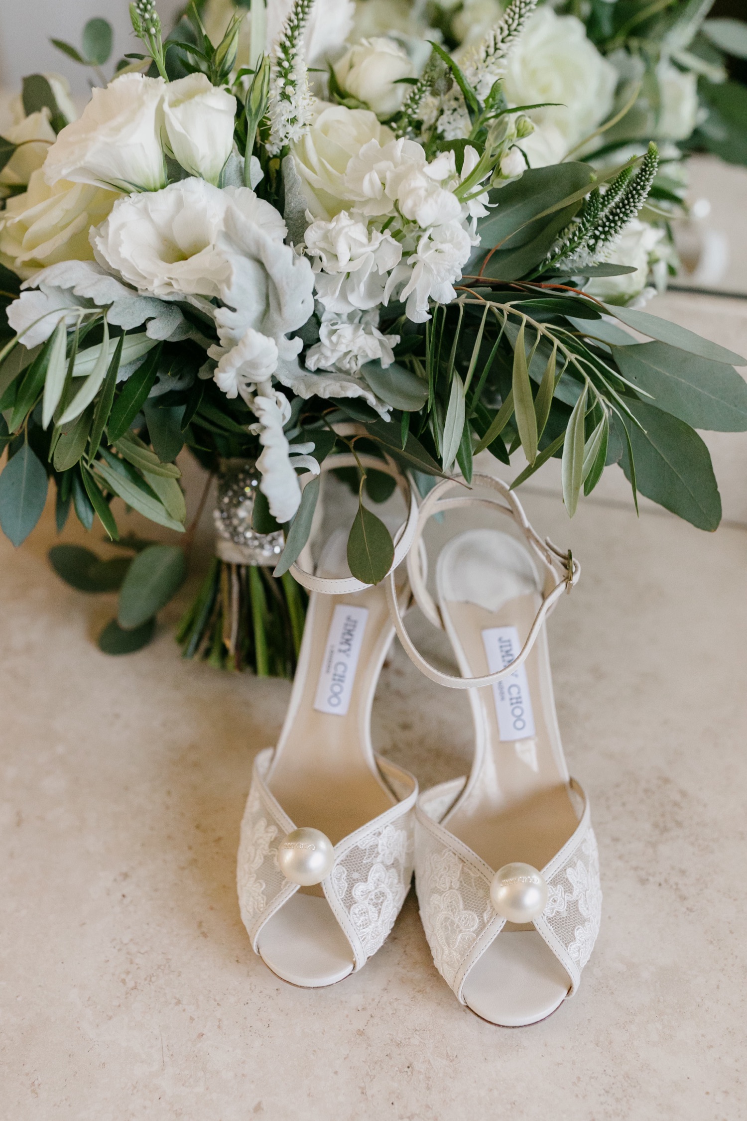 detail photo of wedding Jimmy choo heels and bouquet