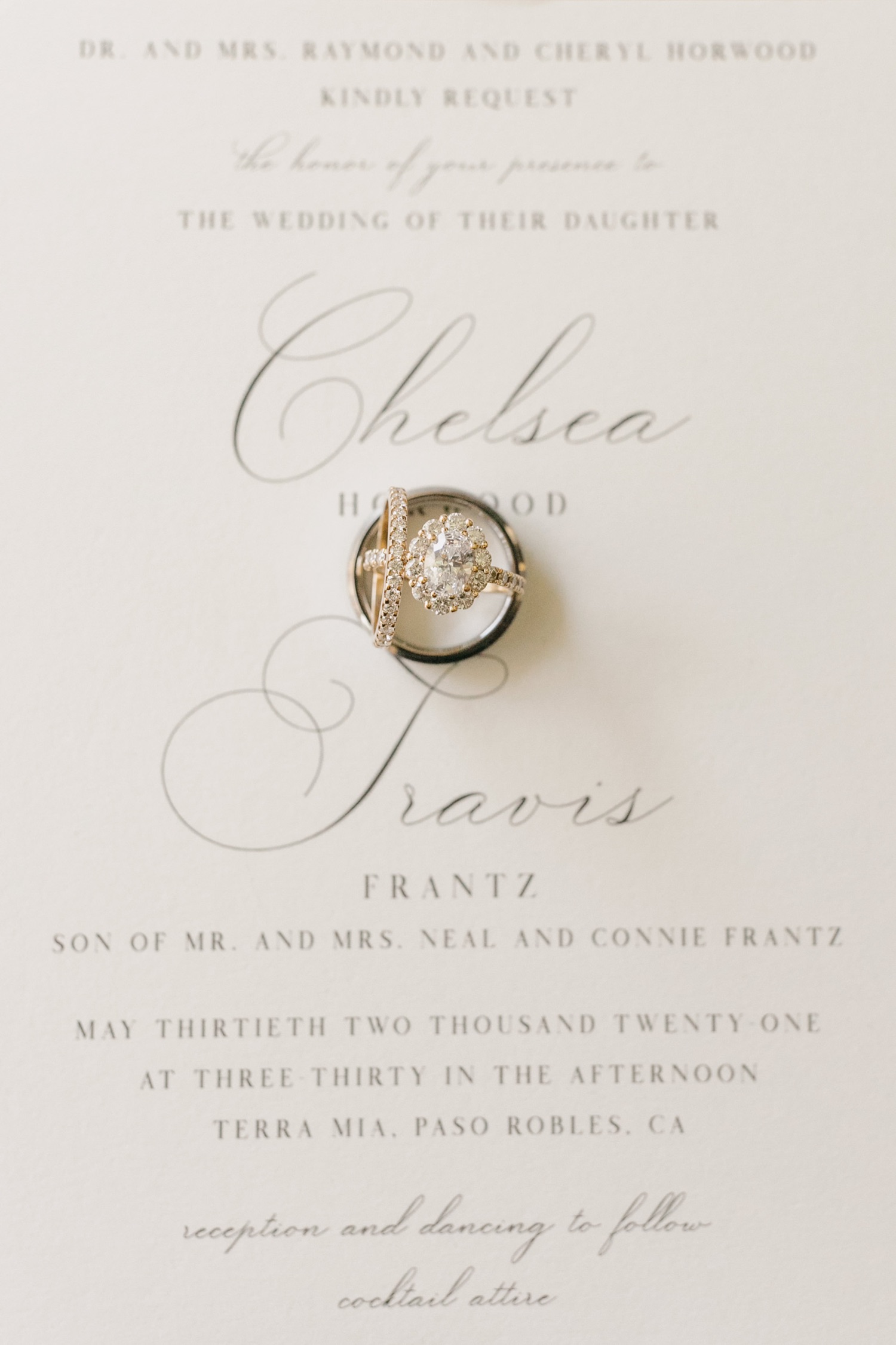 close up photo of rings on invite at terra mia wedding