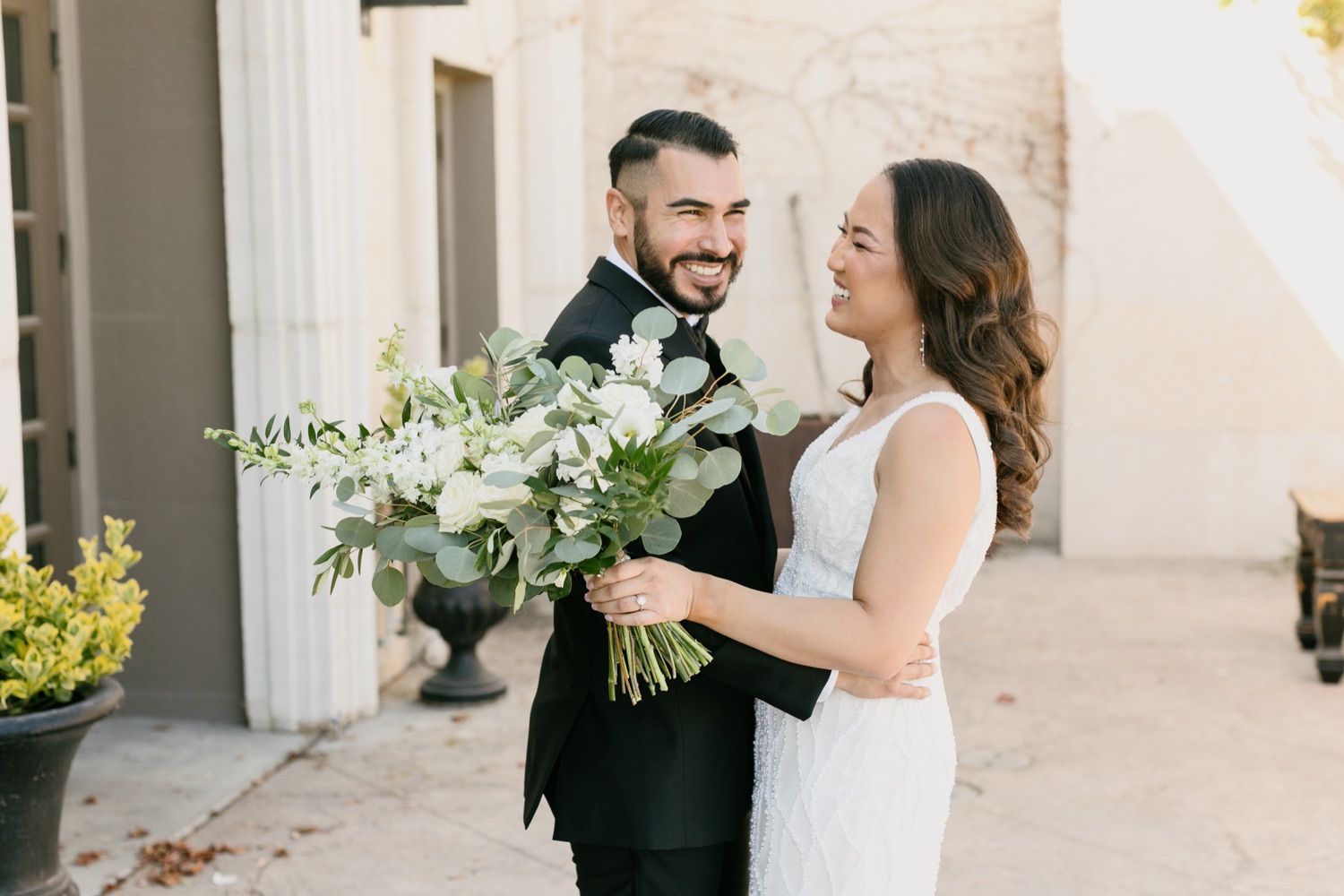 Bride and groom at their first look at Tooth and nail winery in Paso Robles, California by Tayler Enerle Photography