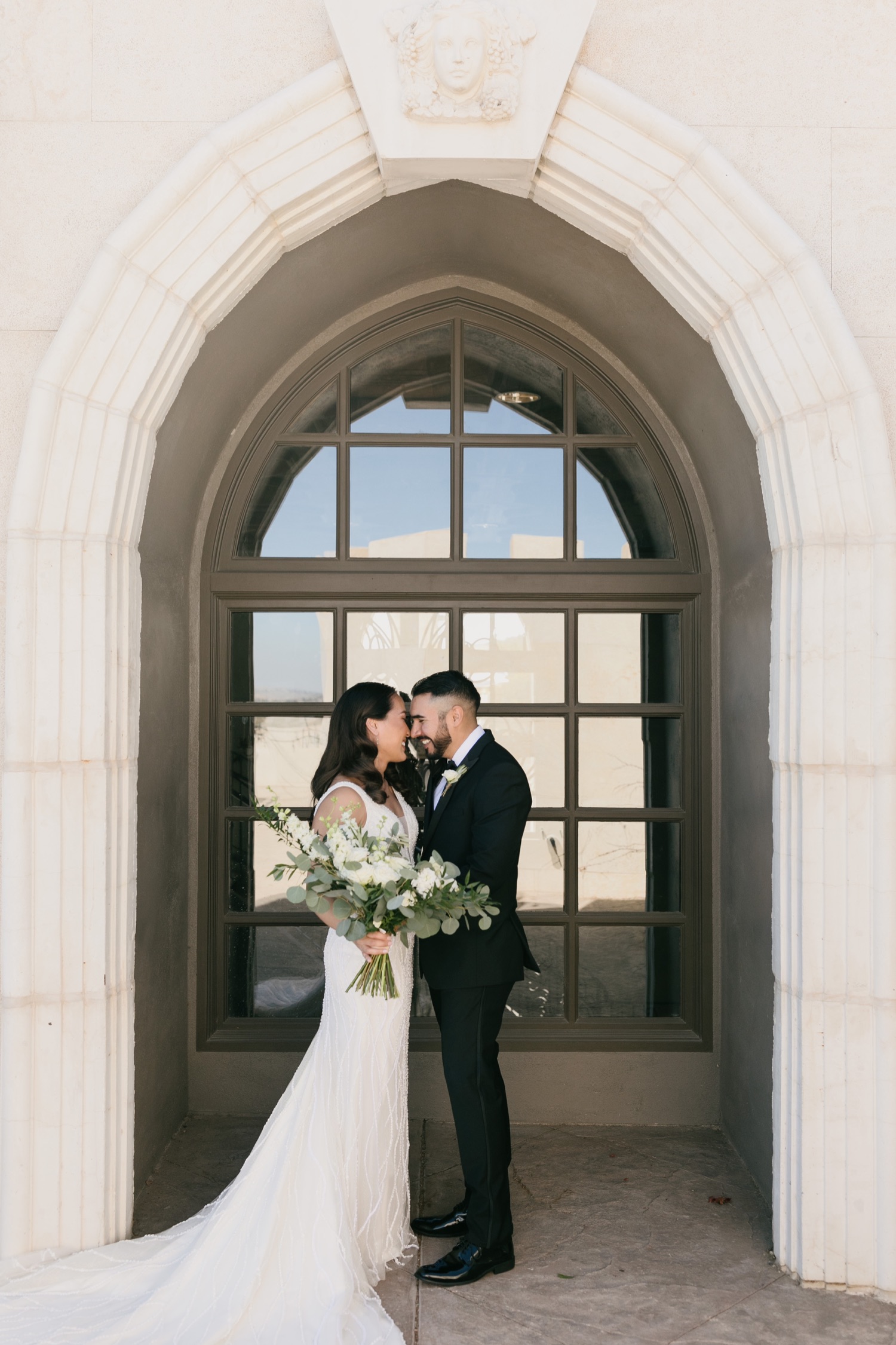 Bride and groom pose at Tooth and nail winery in paso robles, Ca by Tayler Enerle Photography