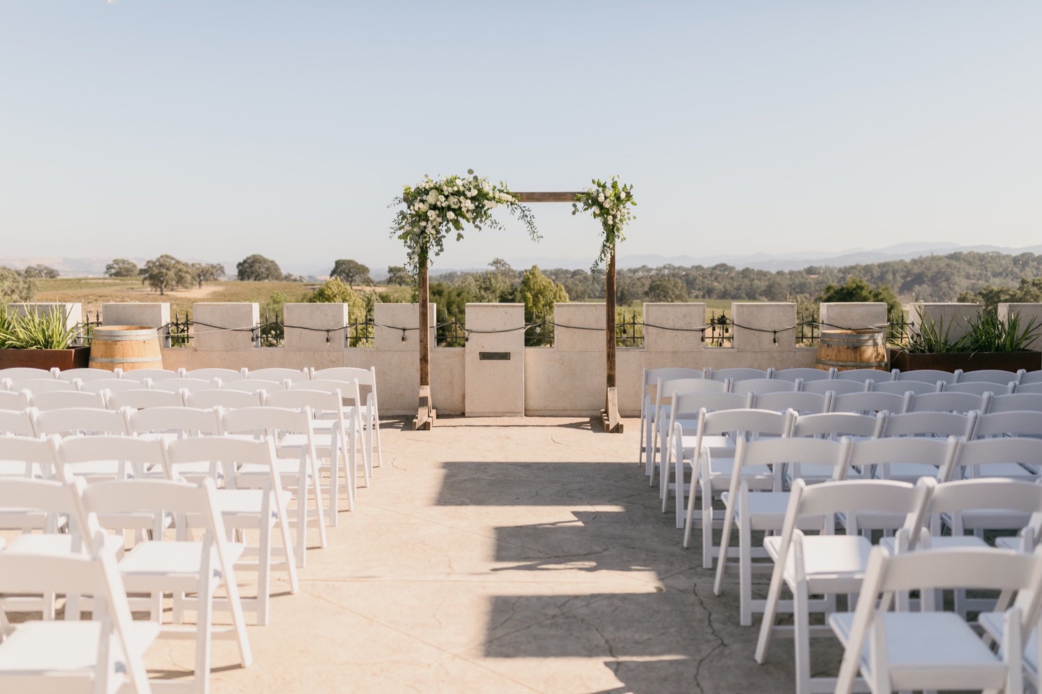 Wedding ceremony arch and seats for tooth and nail winery in paso robles, california