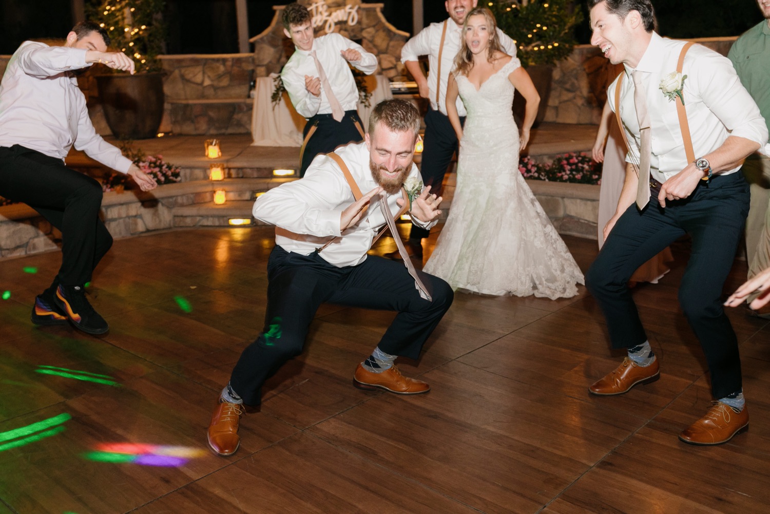 Groom's brother dancing at reception