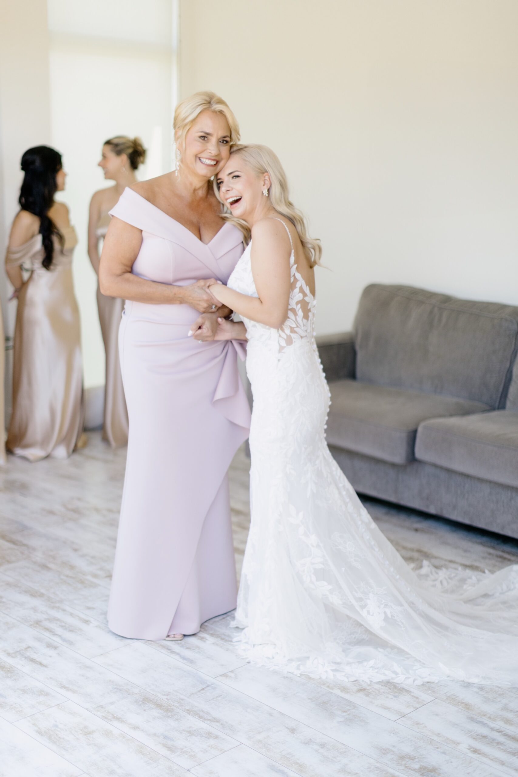 Bride and mother embracing in the getting ready room at their hotel at Cass Winery wedding 